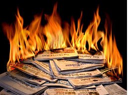 newspapers on fire